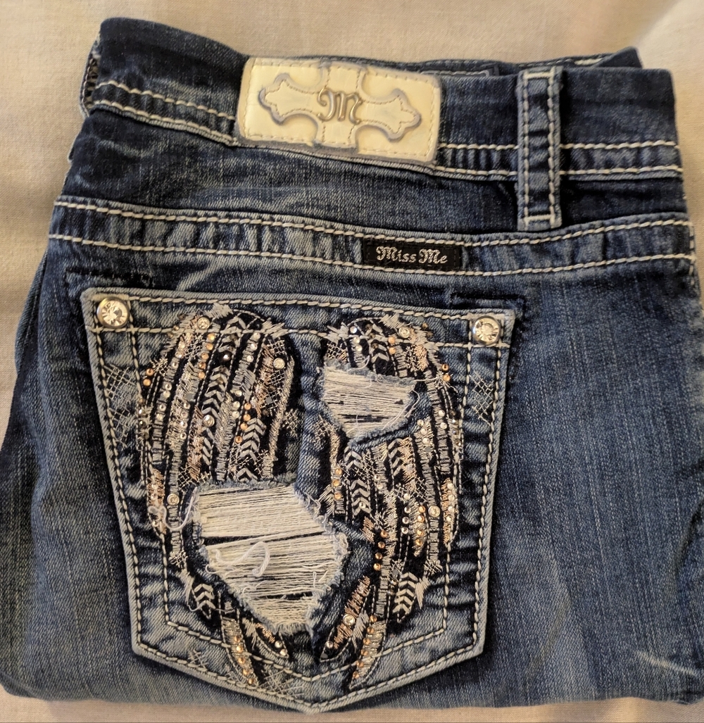 Women Miss Me Dark Blue Jeans with Embellished Heart Pocket. Size 34/26.